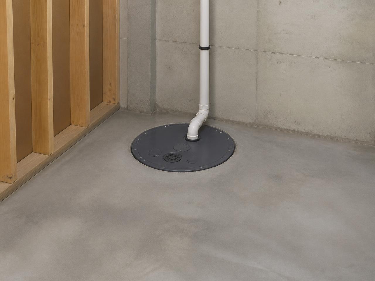 Sump pump basin installed in a Michigan basement to move groundwater away from the foundation